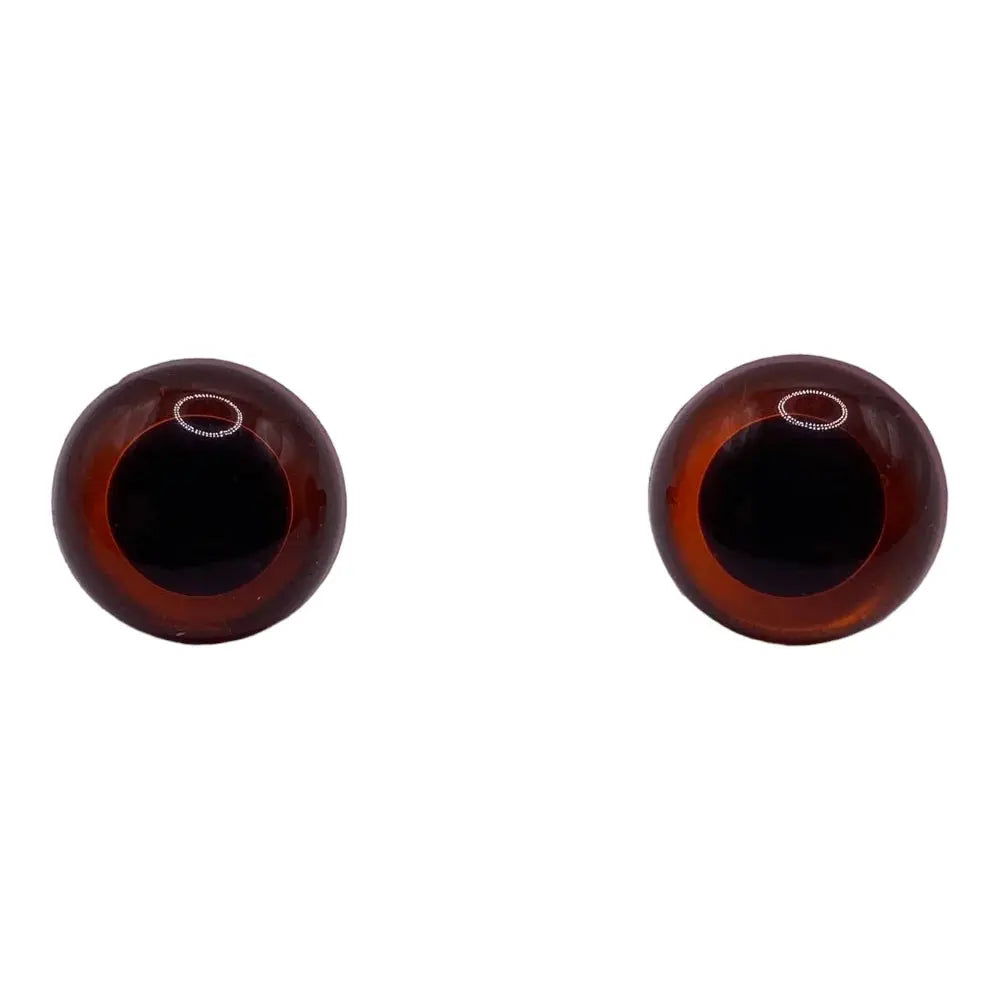 Two brown doll eyes.