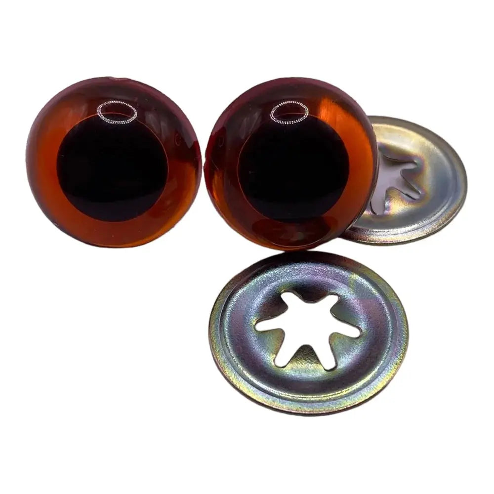 Brown doll eyes with metal washers.