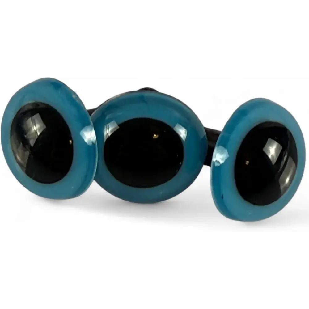 Three blue-rimmed googly eyes.