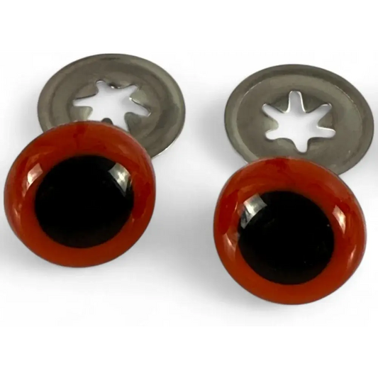 Two brown safety eyes with metal washers.