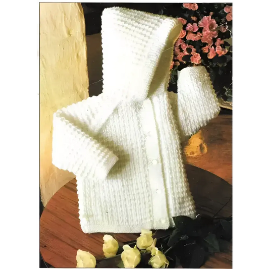 White knitted baby cardigan with hood.