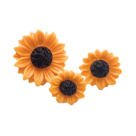 Three orange sunflower decorations.