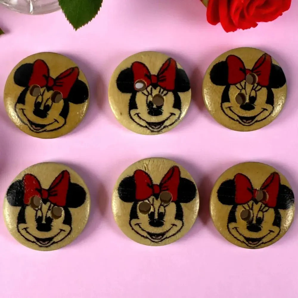 Six wooden Minnie Mouse buttons.