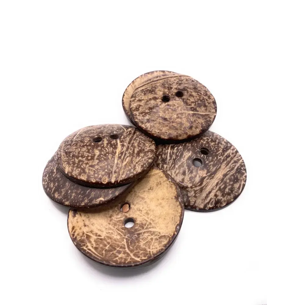 Pile of brown coconut shell buttons.