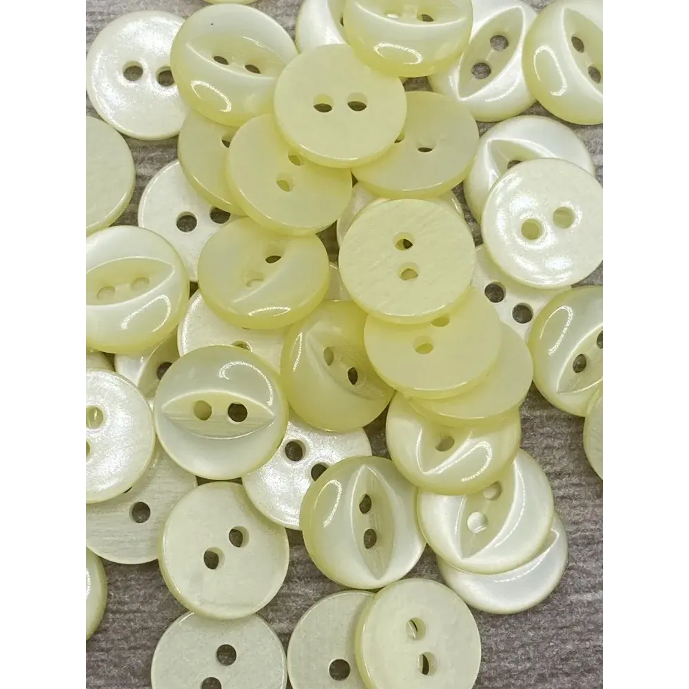 Pile of pale yellow buttons.