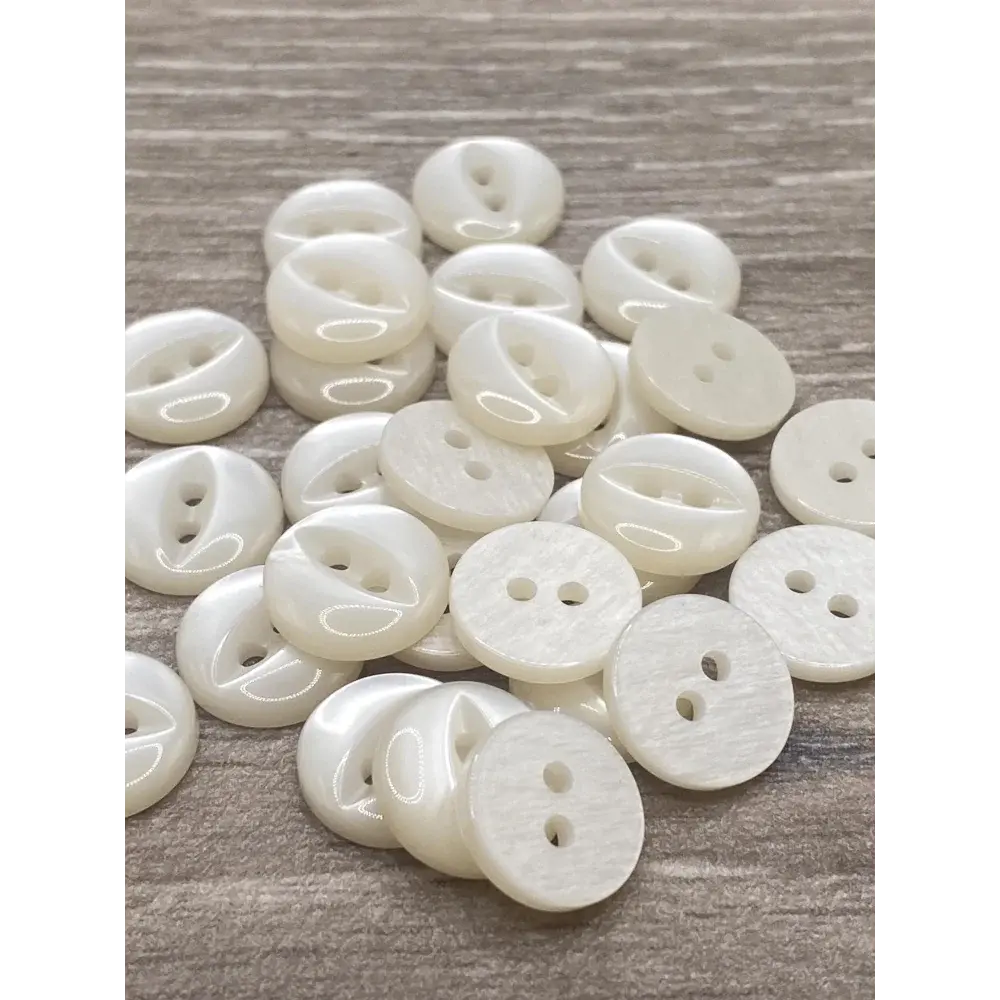 Pile of shiny white buttons.