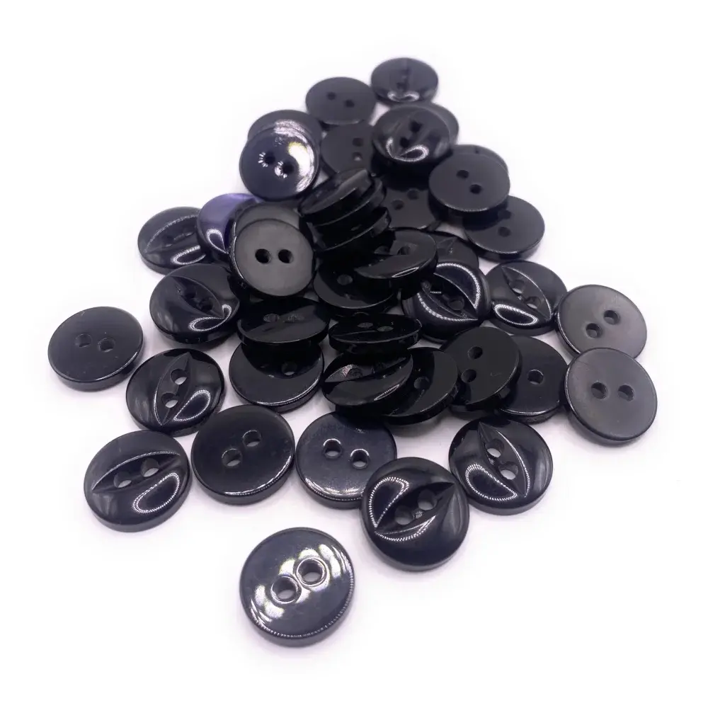 Pile of black two-hole buttons.