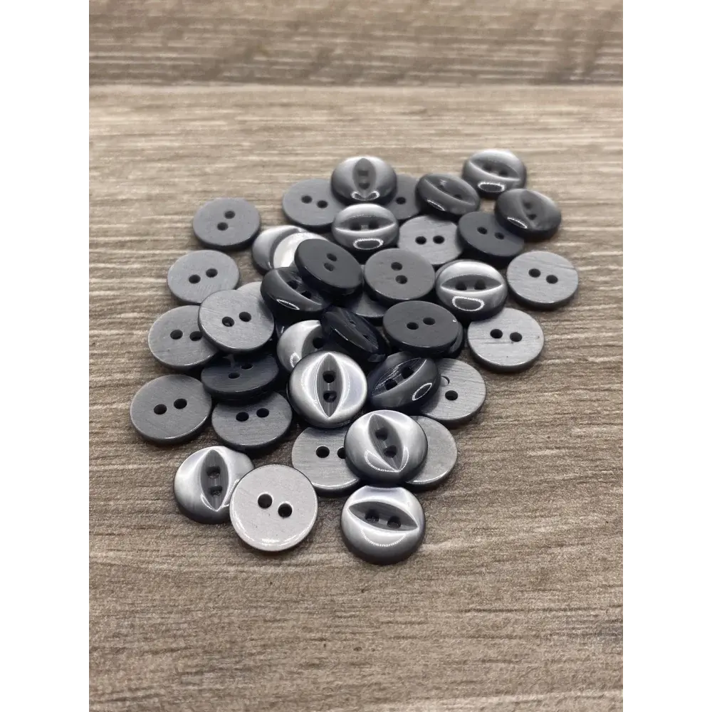 Assorted gray and silver buttons.