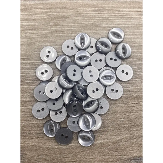 Pile of gray two-hole buttons.