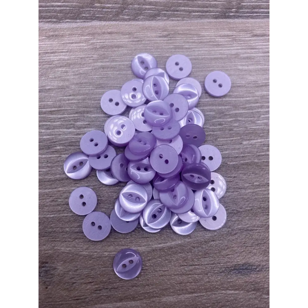 Pile of lavender buttons.