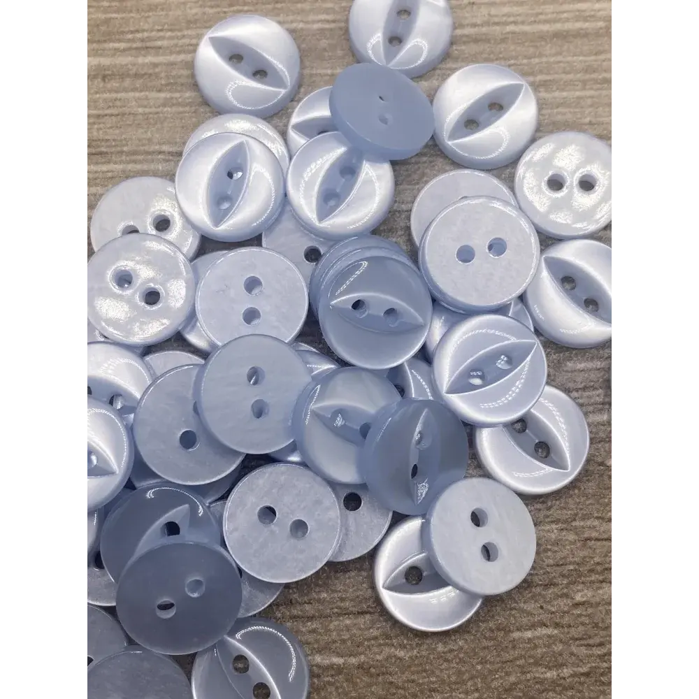 Pile of light blue buttons.