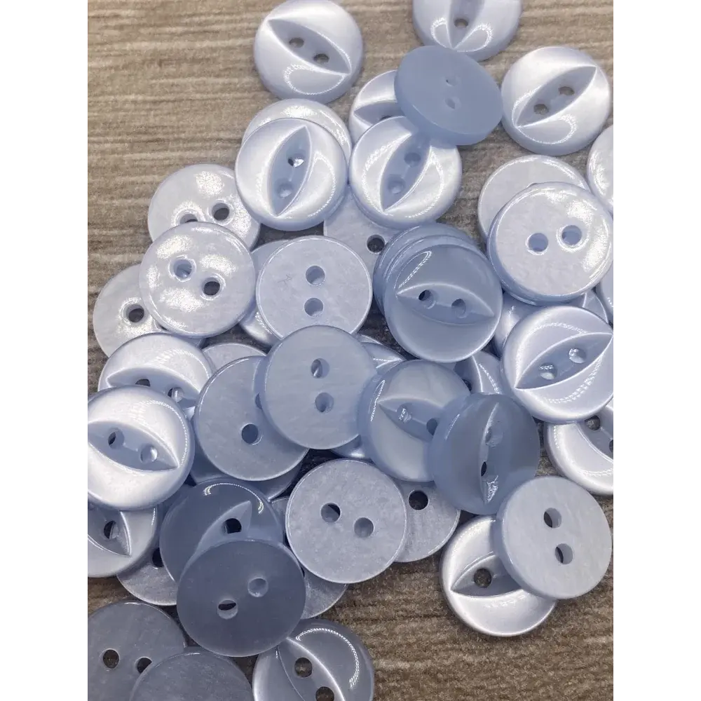 Pile of light blue buttons.
