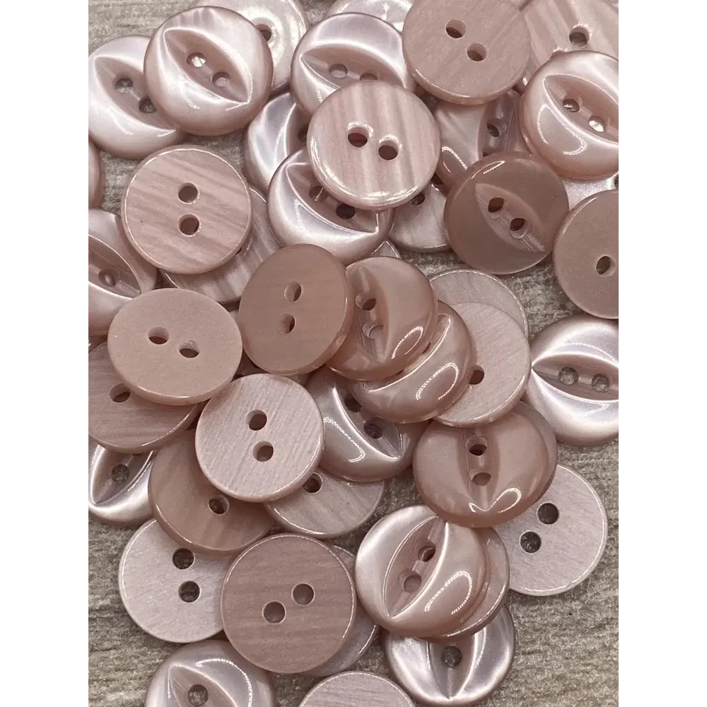 Pile of pink two-hole buttons.