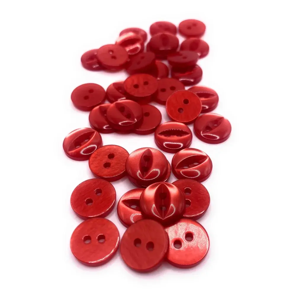 Pile of red sewing buttons.