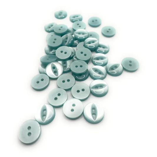 Pile of light blue buttons.