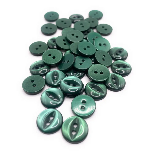 Pile of green two-hole buttons.