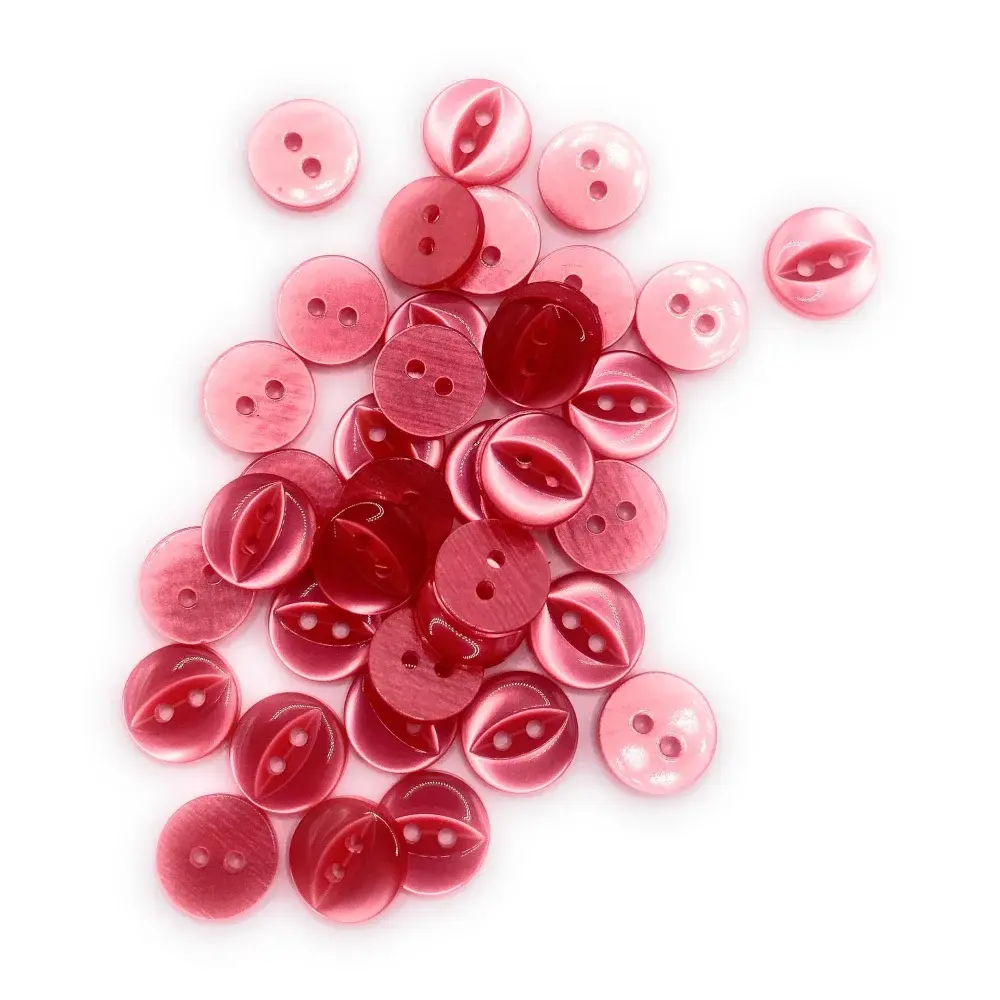 Pile of pink and red buttons.