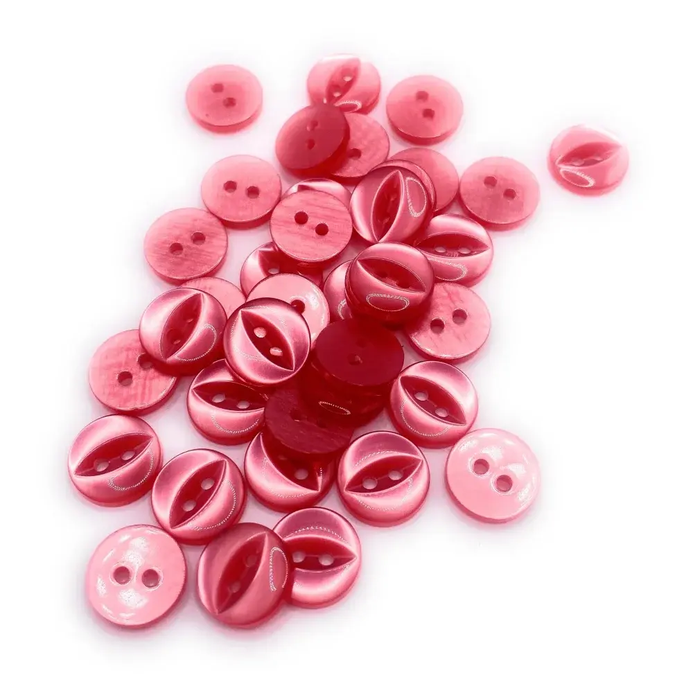 Pile of pink and red two-hole buttons.