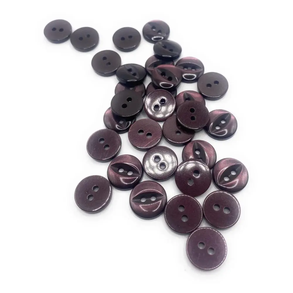 Pile of two-hole purple buttons.