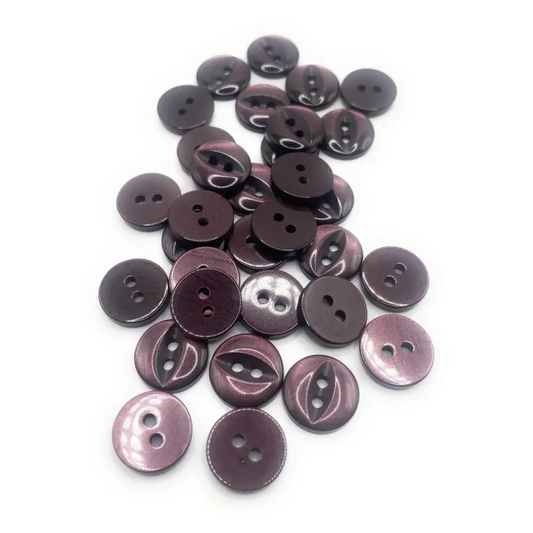 Pile of two-hole purple buttons.