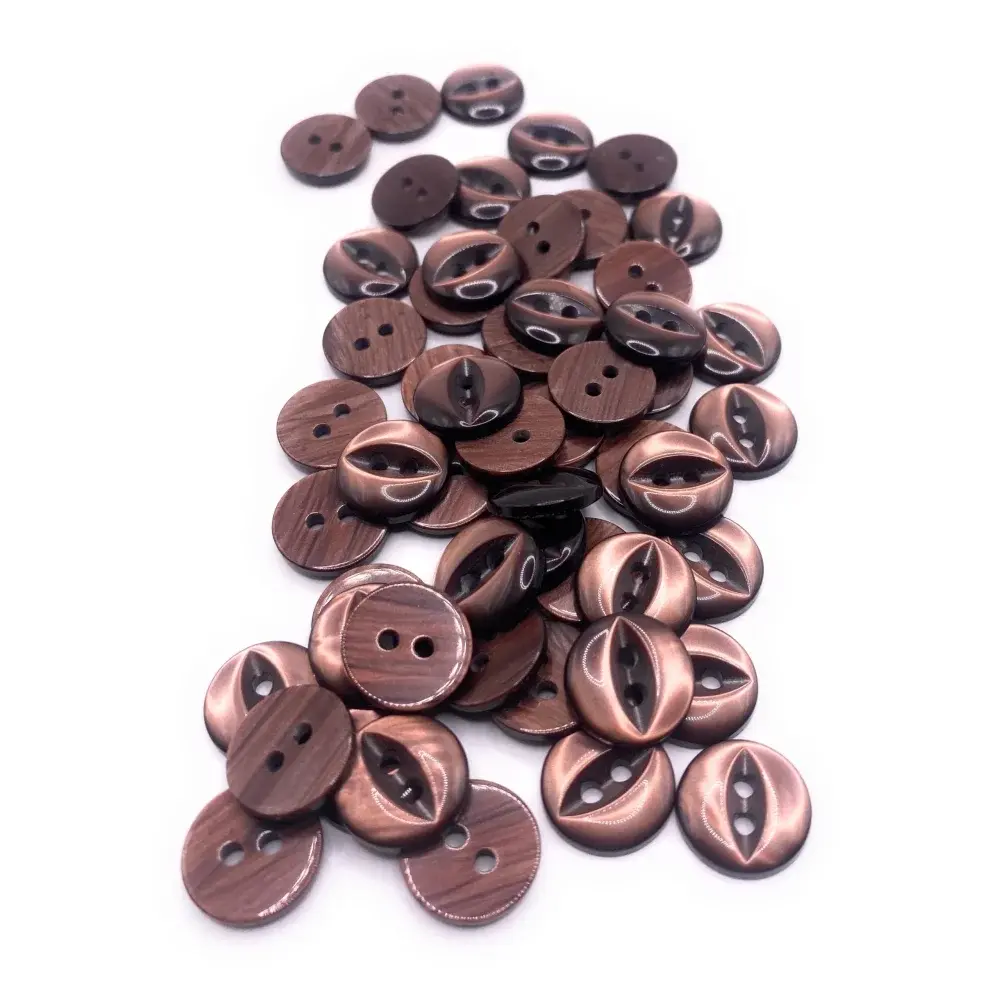 Pile of brown and bronze buttons.