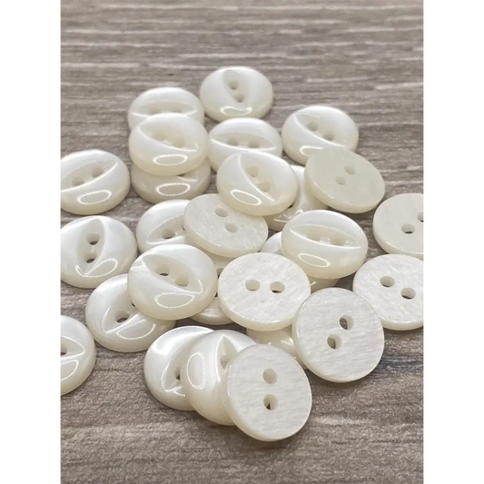 Pile of shiny white buttons.