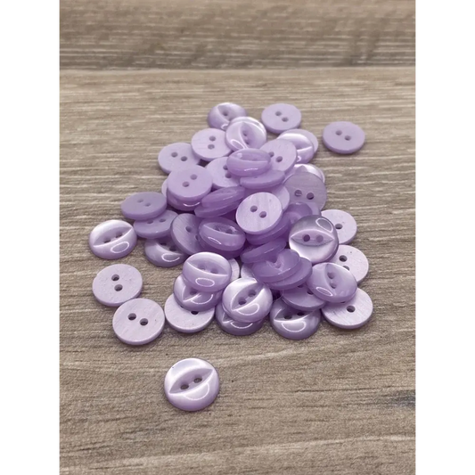 Pile of lavender two-hole buttons.