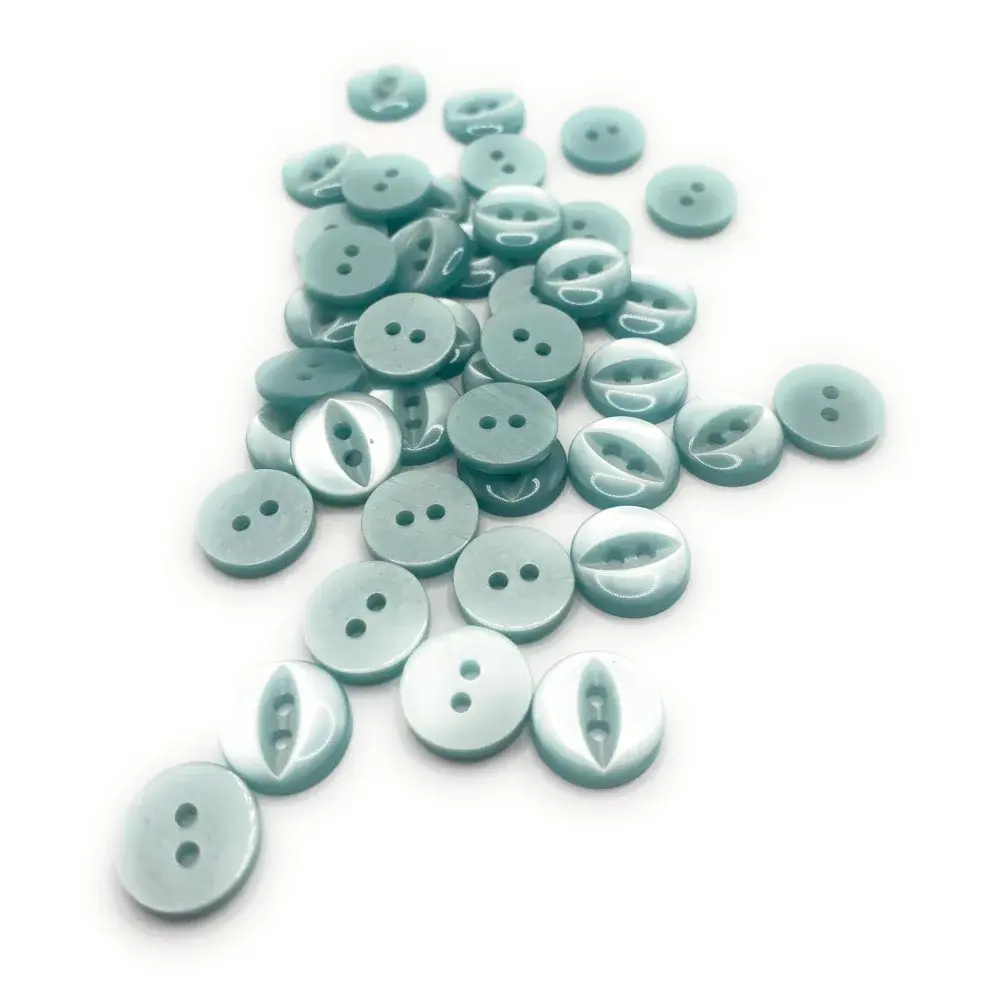 Pile of light blue buttons.