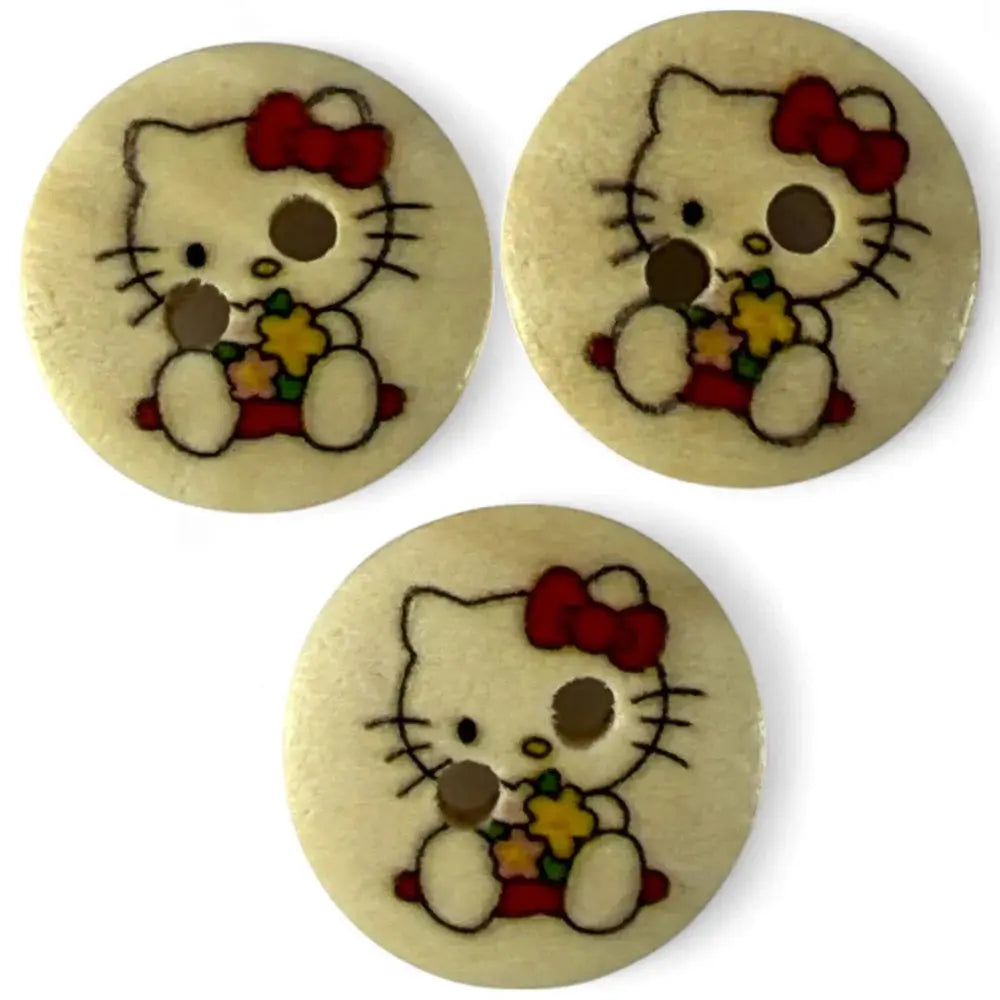 Three Hello Kitty buttons.