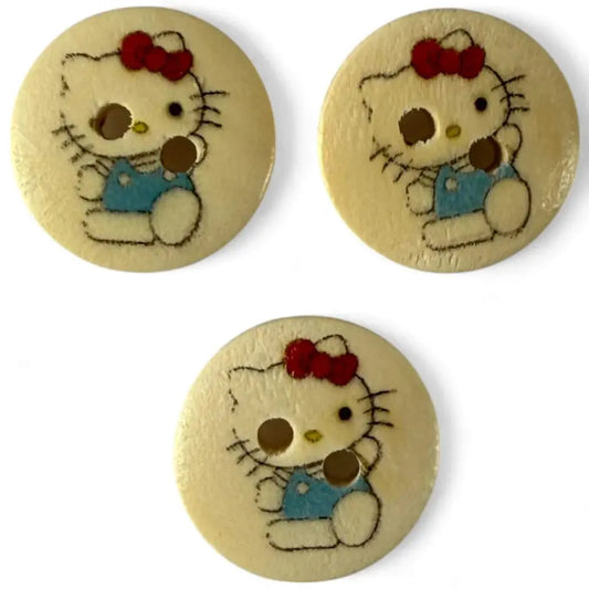 Three Hello Kitty buttons.
