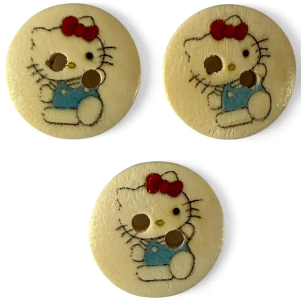 Three Hello Kitty buttons.