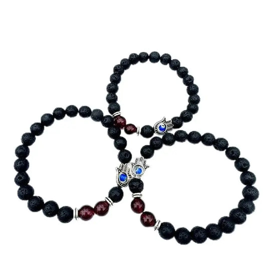 Three beaded bracelets with Hamsa charms.