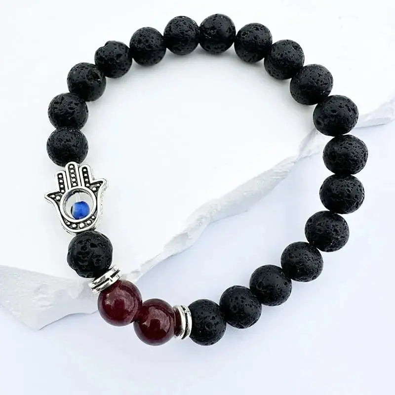 Black lava bead bracelet with hamsa charm.