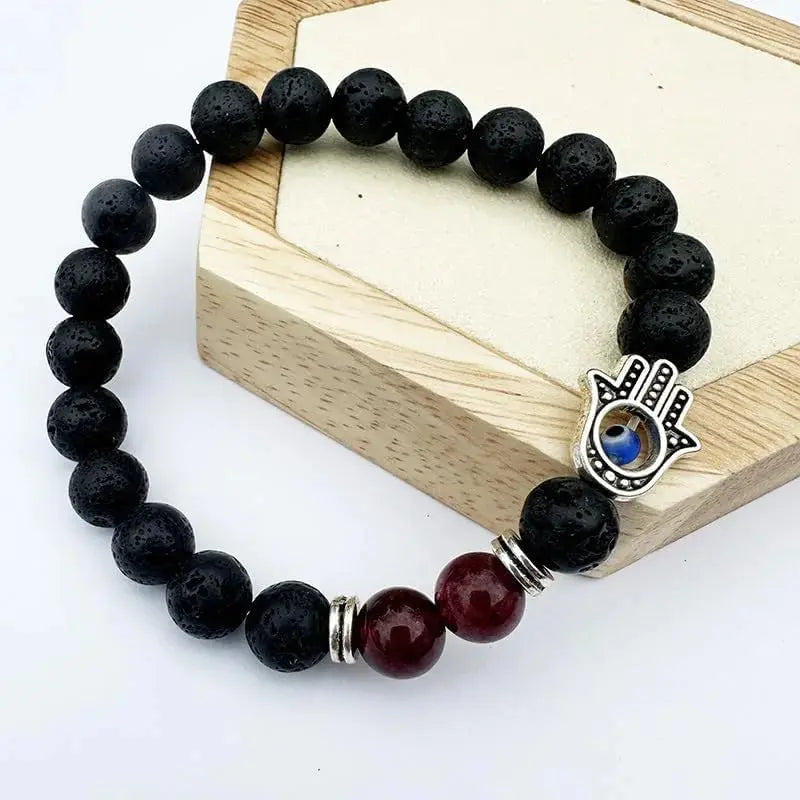Black lava bead bracelet with Hamsa charm.
