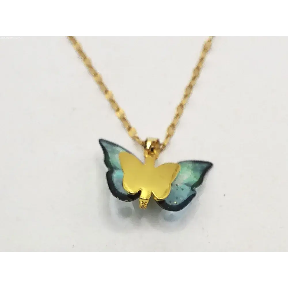 Gold butterfly pendant necklace.