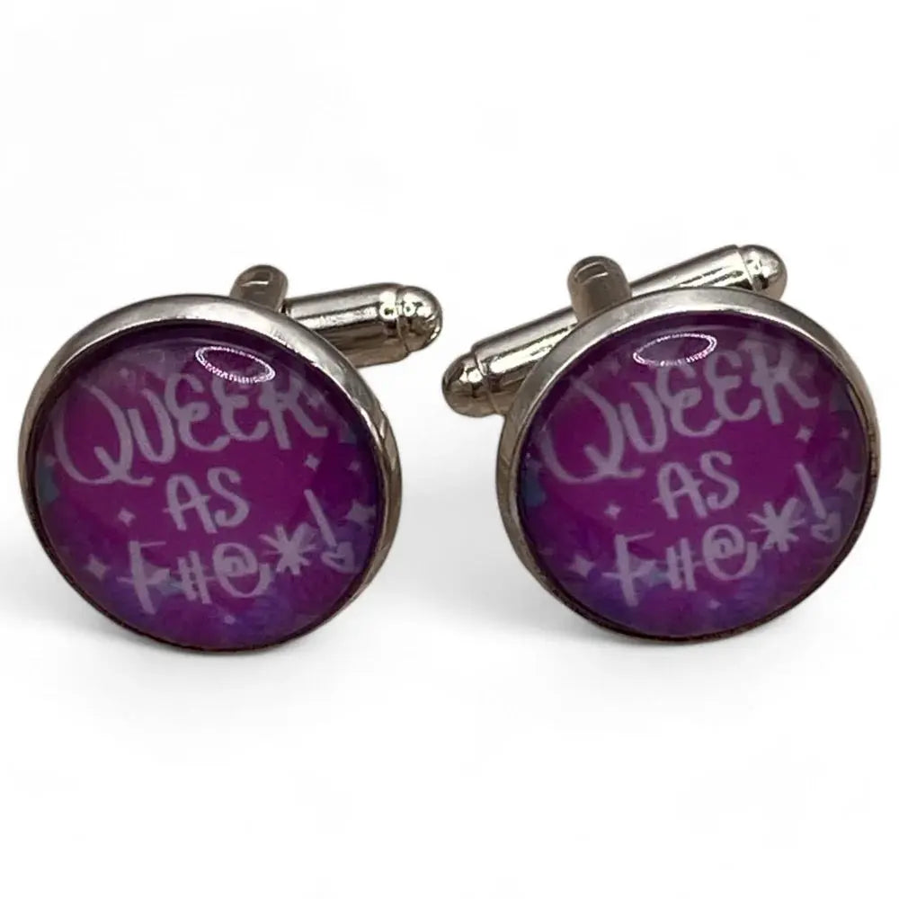 Pair of round cufflinks with purple background.