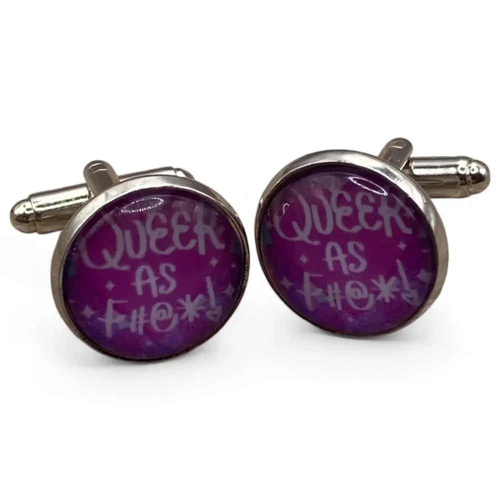 Pair of silver cufflinks with purple ’Queer as F***’ design.