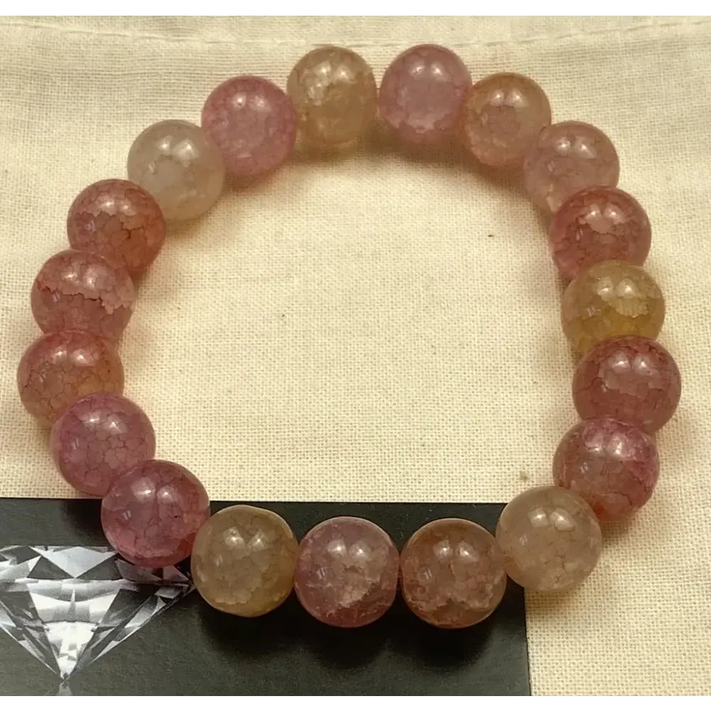 Pink and yellow beaded bracelet.