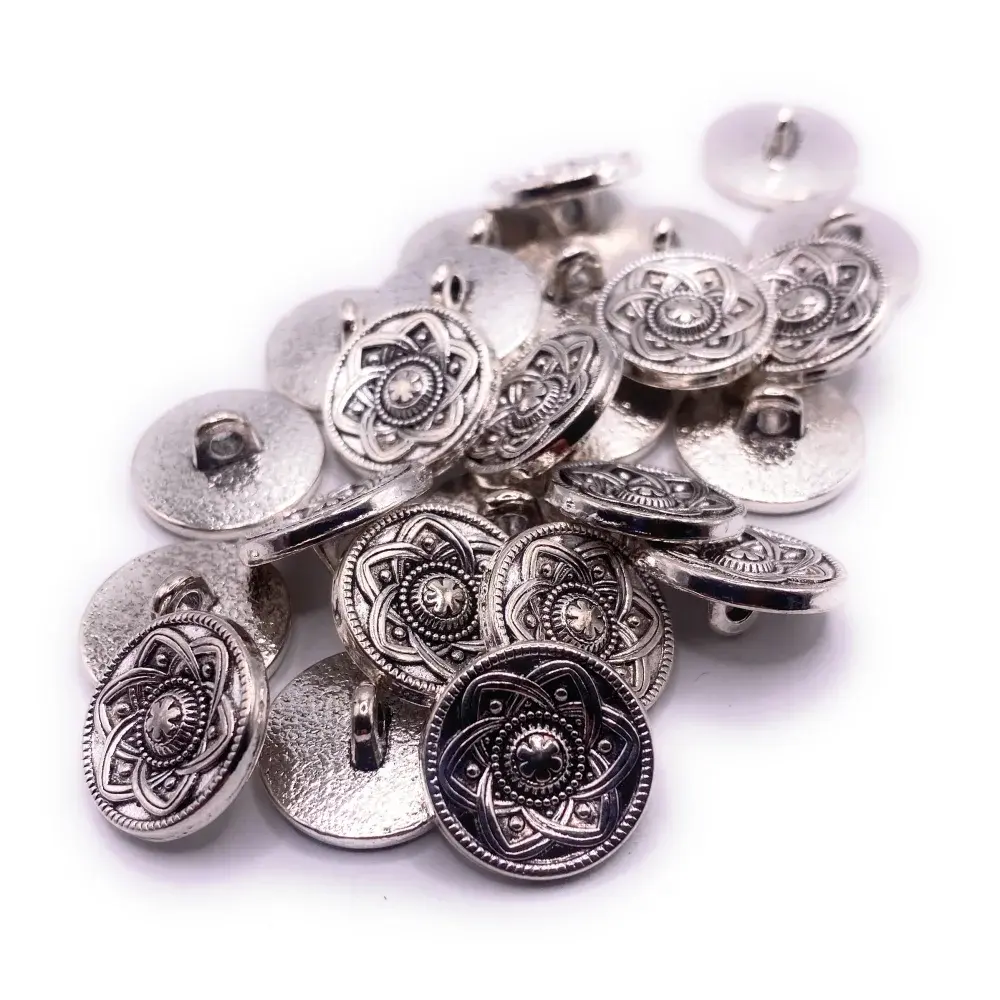 Pile of decorative silver buttons.