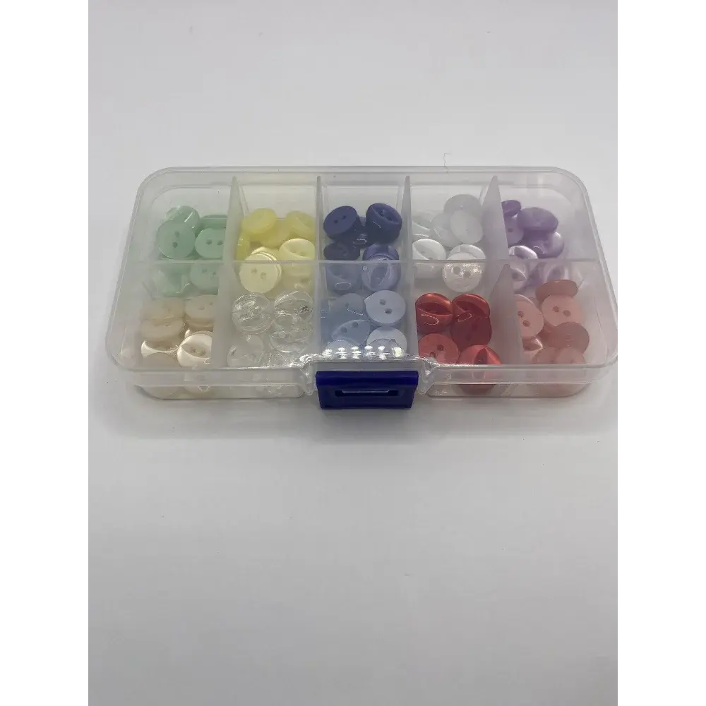 Compartmentalized box of colorful buttons.