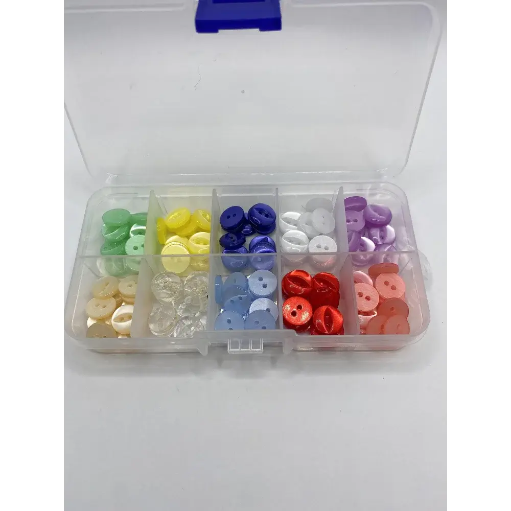 Compartmentalized box of colorful buttons.