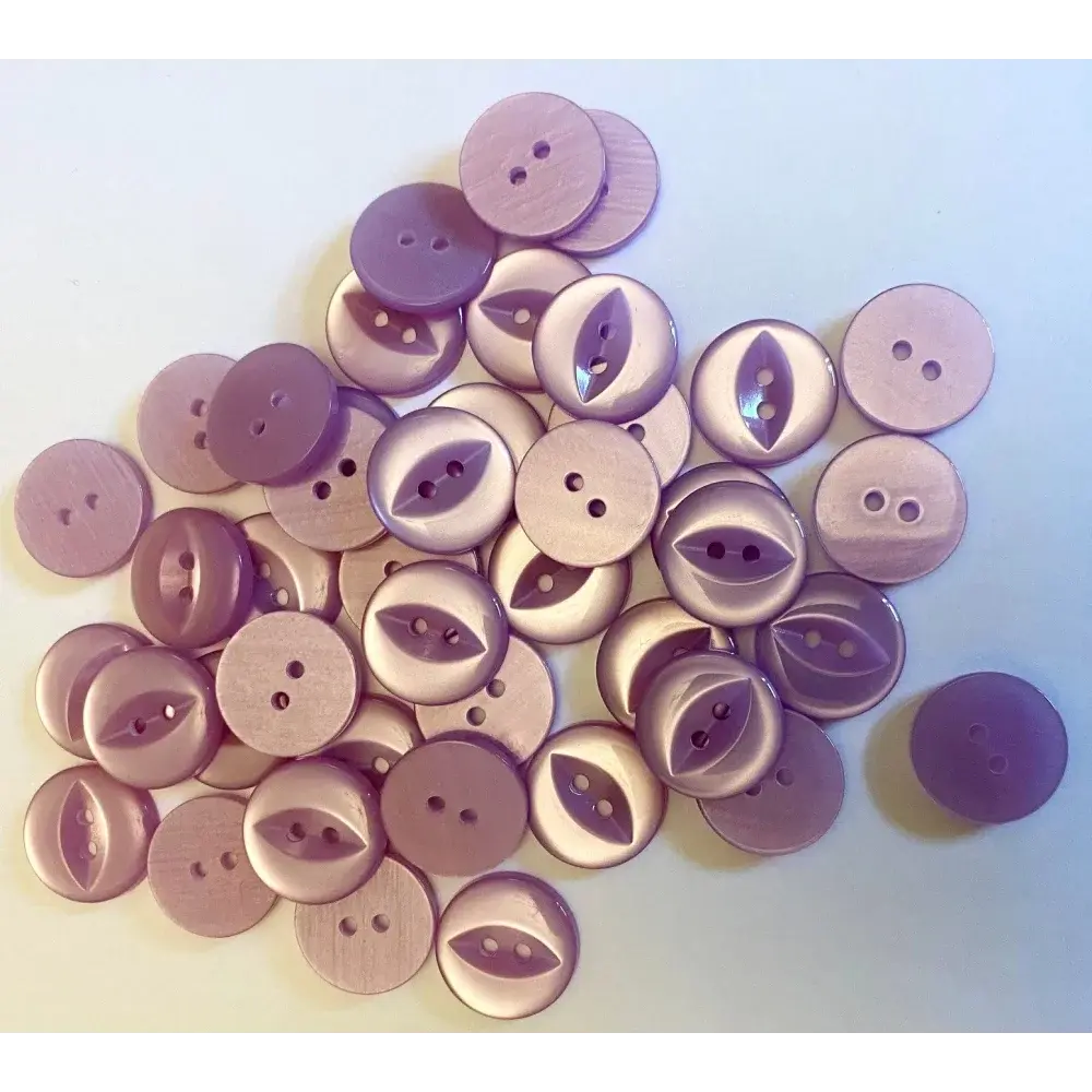 Pile of mauve-colored buttons.