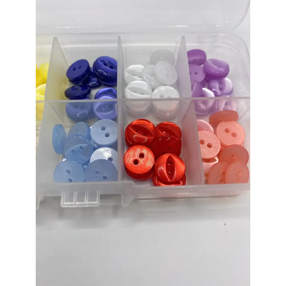 Compartmentalized box of colorful buttons.