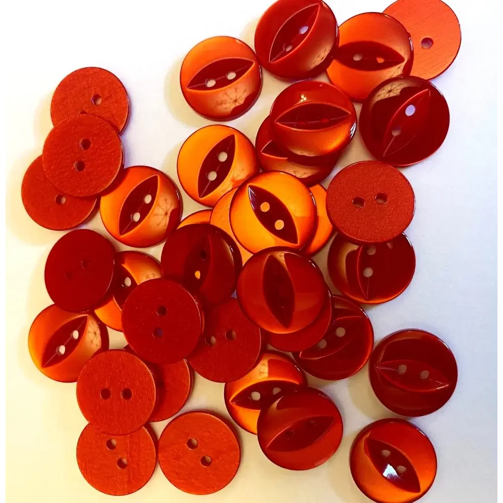Pile of red and orange buttons.