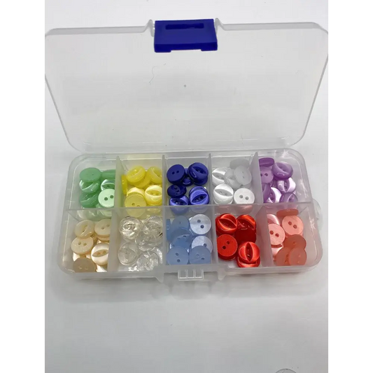 Compartmentalized box of colorful buttons.