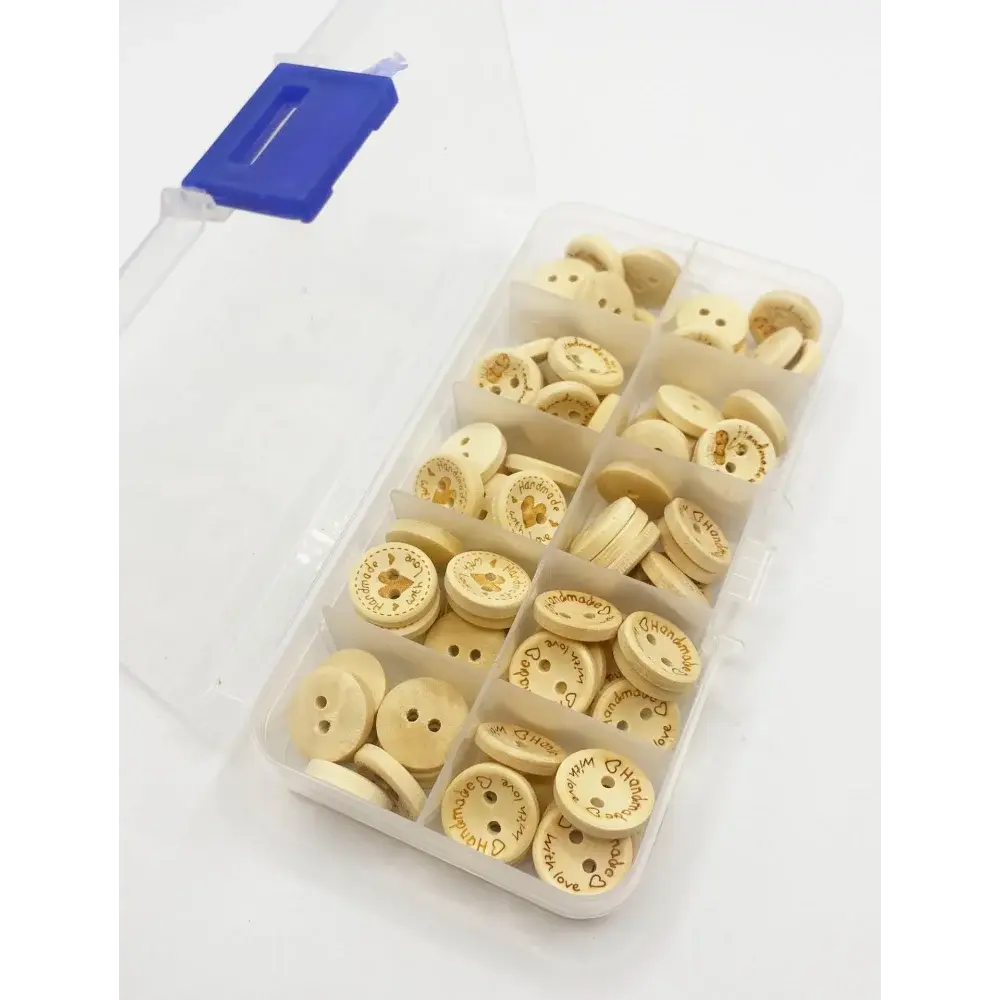Compartmentalized box of craft buttons.