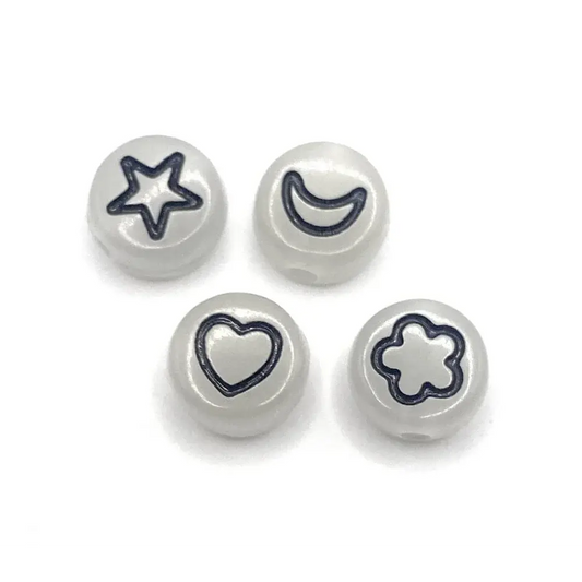 Four white beads with star, moon, heart, and flower designs.
