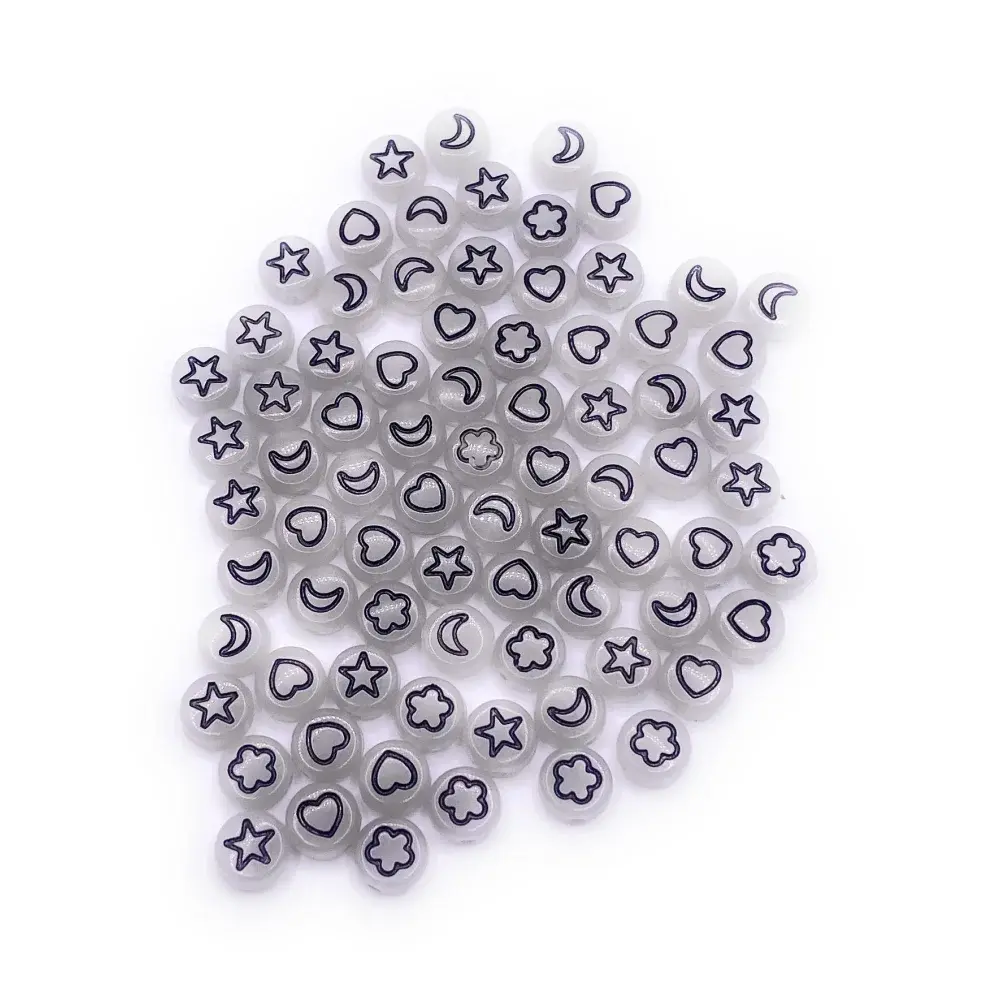 Translucent beads with black shapes.