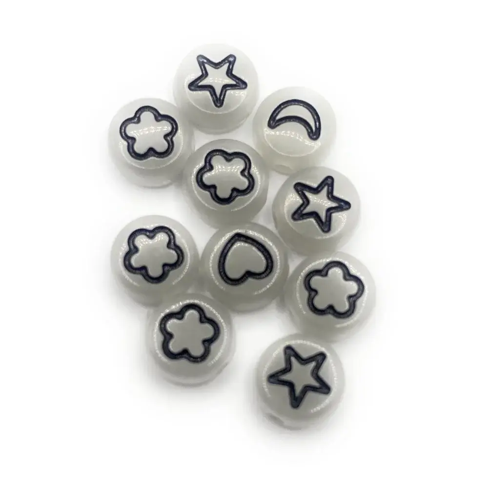 White beads with black shapes.