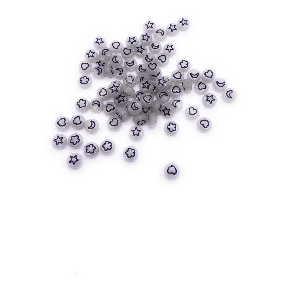 Scattered white beads with black symbols.